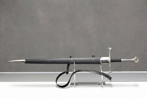 Andúril Sword - The Lord of the Rings: Black leather scabbard and silver sword with ornate hilt on clear stand, gray background