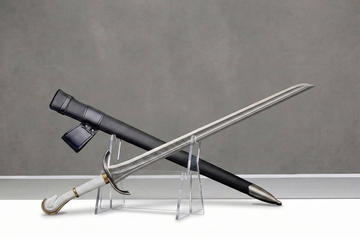 Halbrand's Sword - The Lord of the Rings: The Rings of Power: Silver sword with engraved blade, white grip, black scabbard on clear stands, gray background