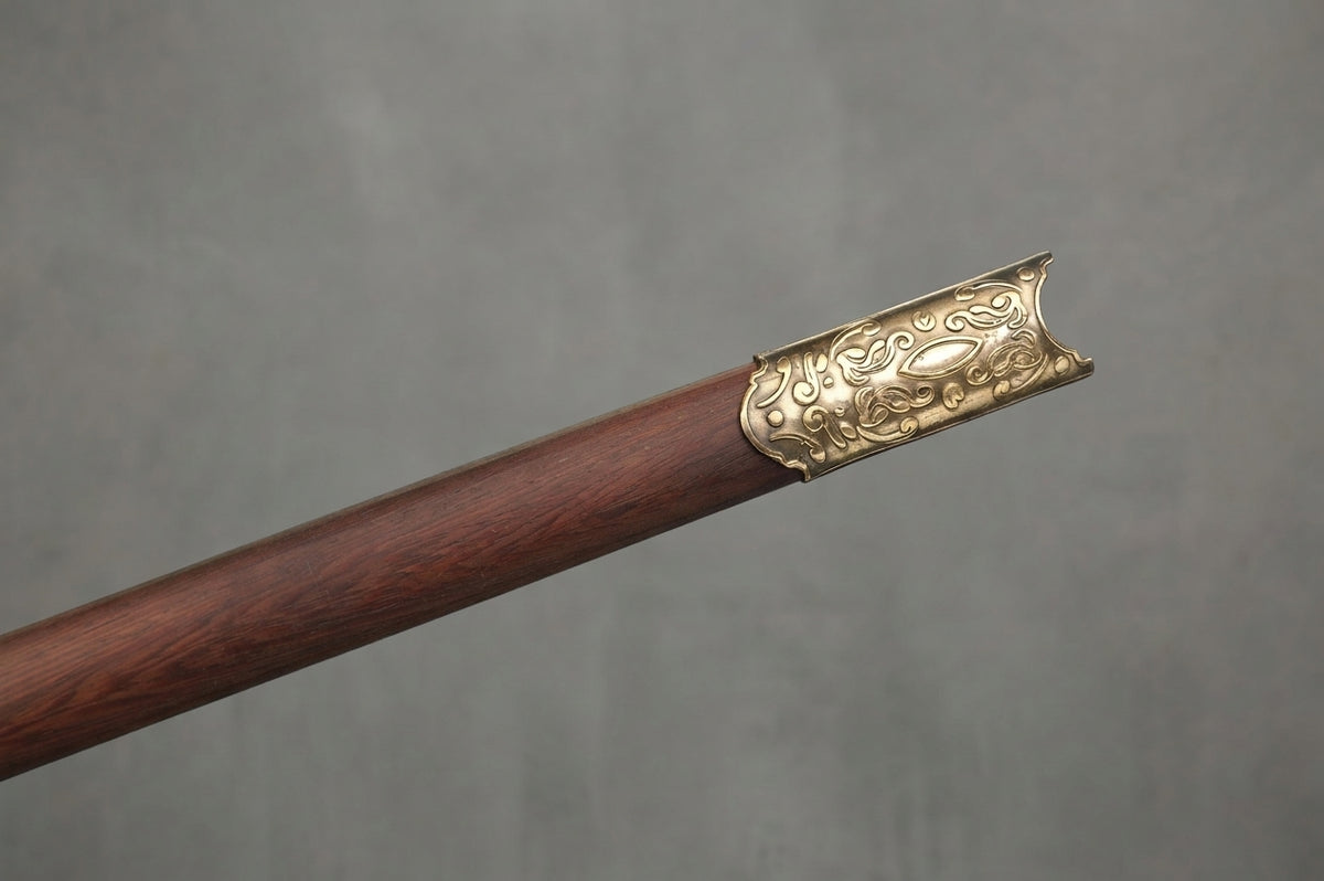 Needle - Arya Stark's Sword - Game of Thrones: Dark brown wooden sword scabbard with ornate gold-colored metal fitting against a grey background