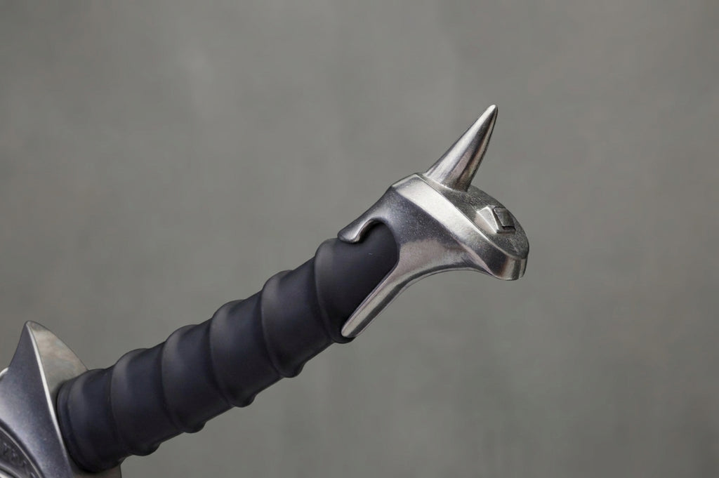 Orcrist Sword - The Hobbit: Sword hilt with black spiral grip, silver metallic pommel with spike, on grey background