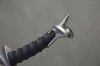 Orcrist Sword - The Hobbit: Sword hilt with black spiral grip, silver metallic pommel with spike, on grey background