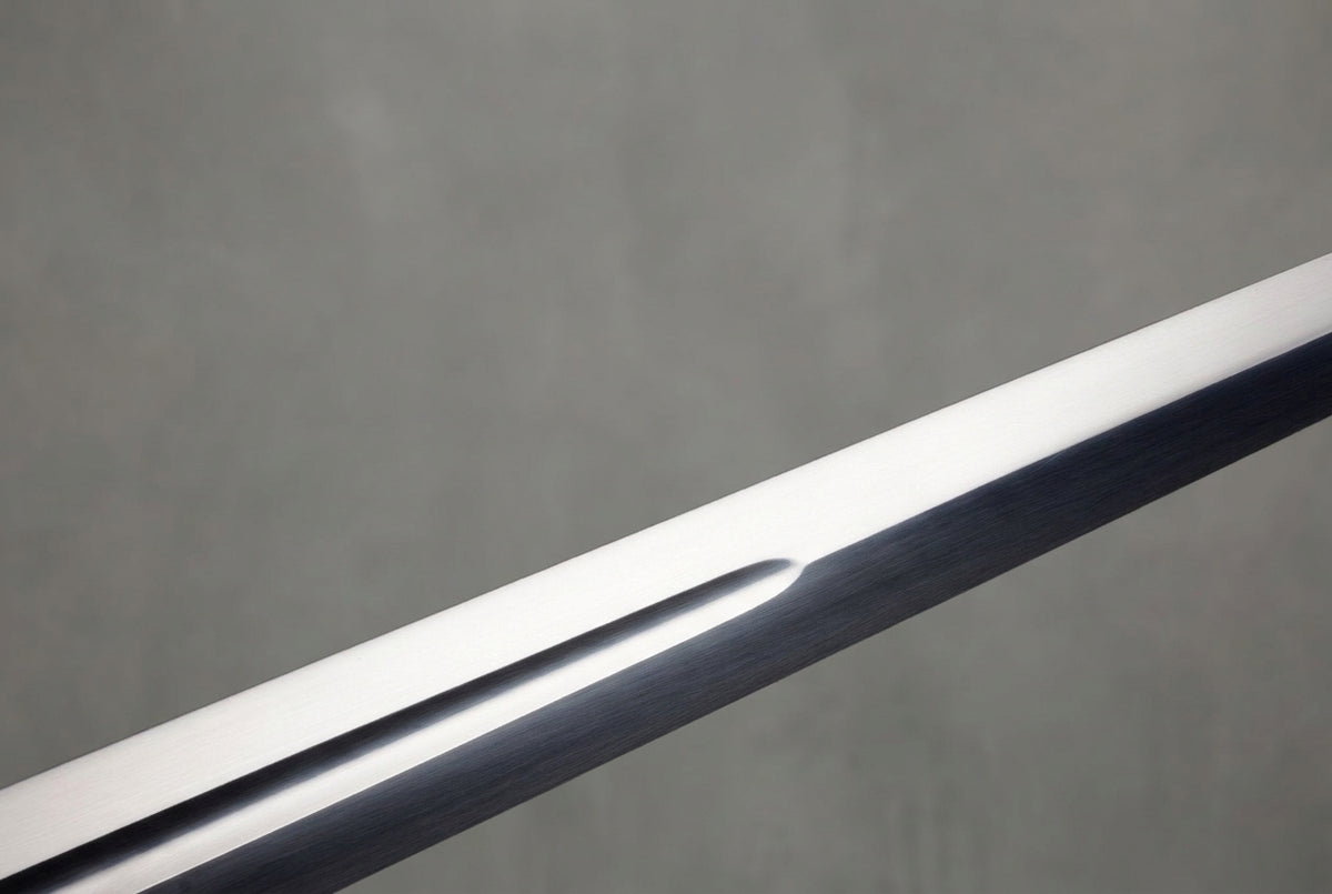 Wintercross Longsword: Polished steel sword blade with fuller, dark reflections, on plain grey background